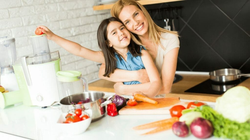 Mother and child hug in the kitchen
