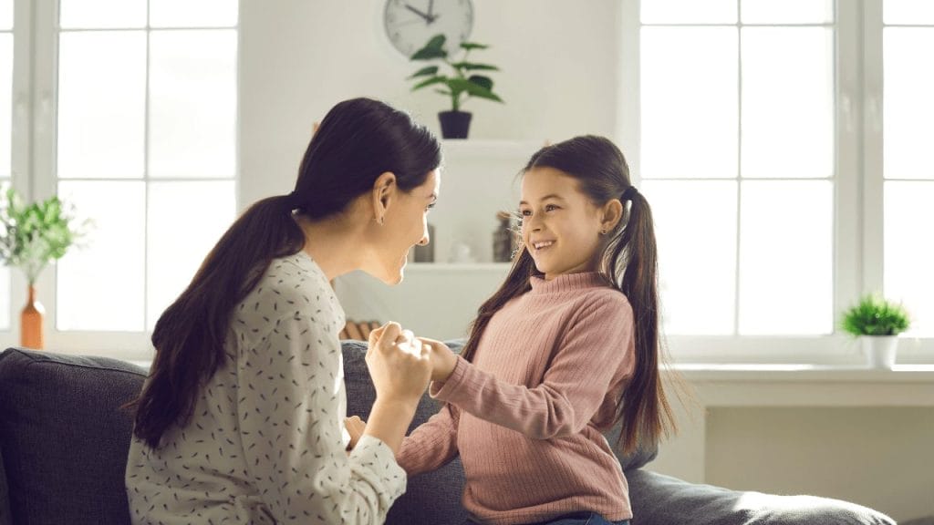 Mum talks with her daughter about the back-to-school experience after summertime